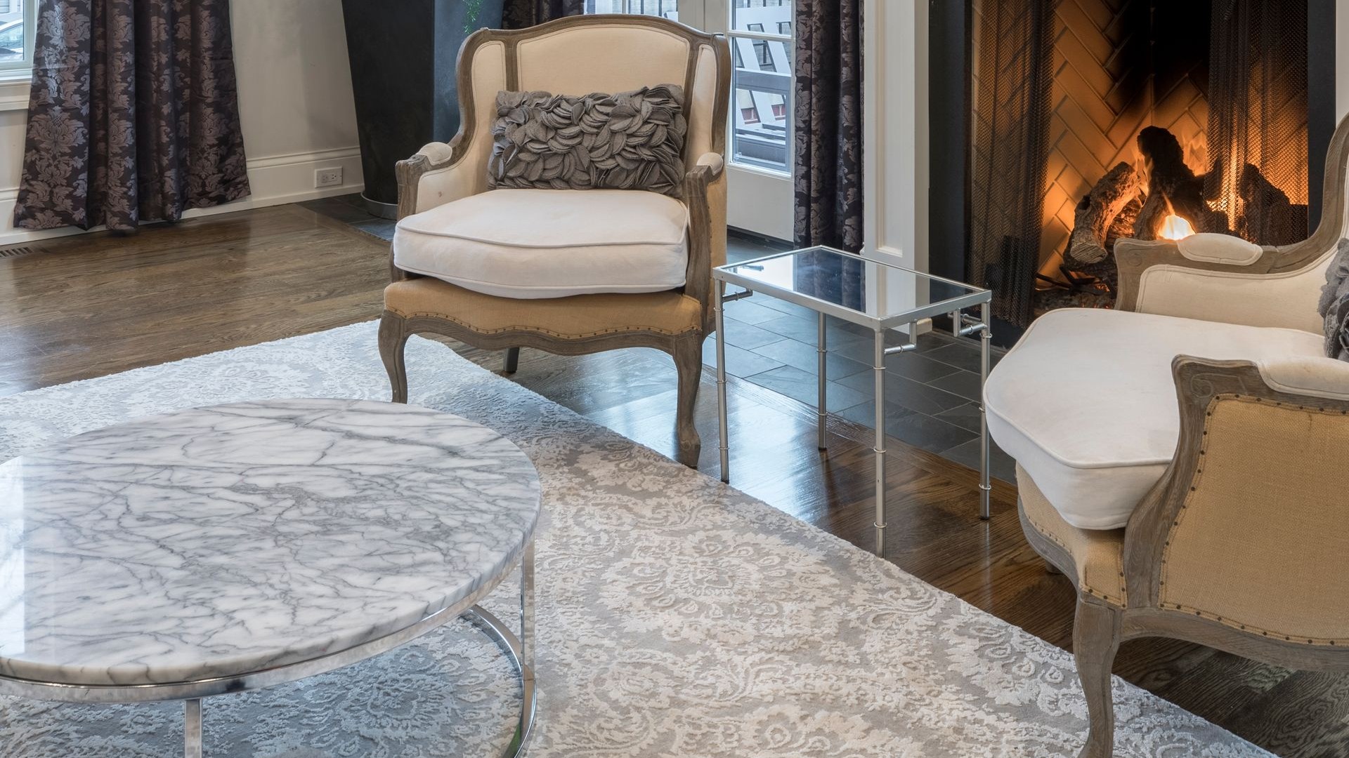 Elegant living room with a lit gas fireplace — gas fireplace service and repair in Clark County, WA